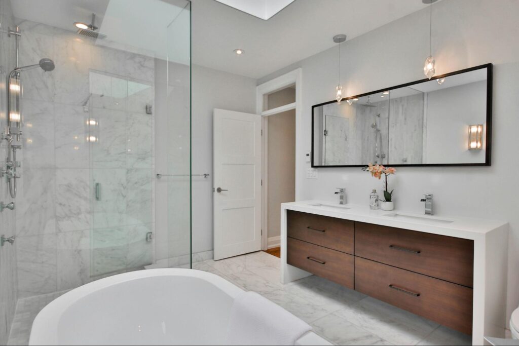 Modern bathroom with double vanity, walk-in shower and bathtub